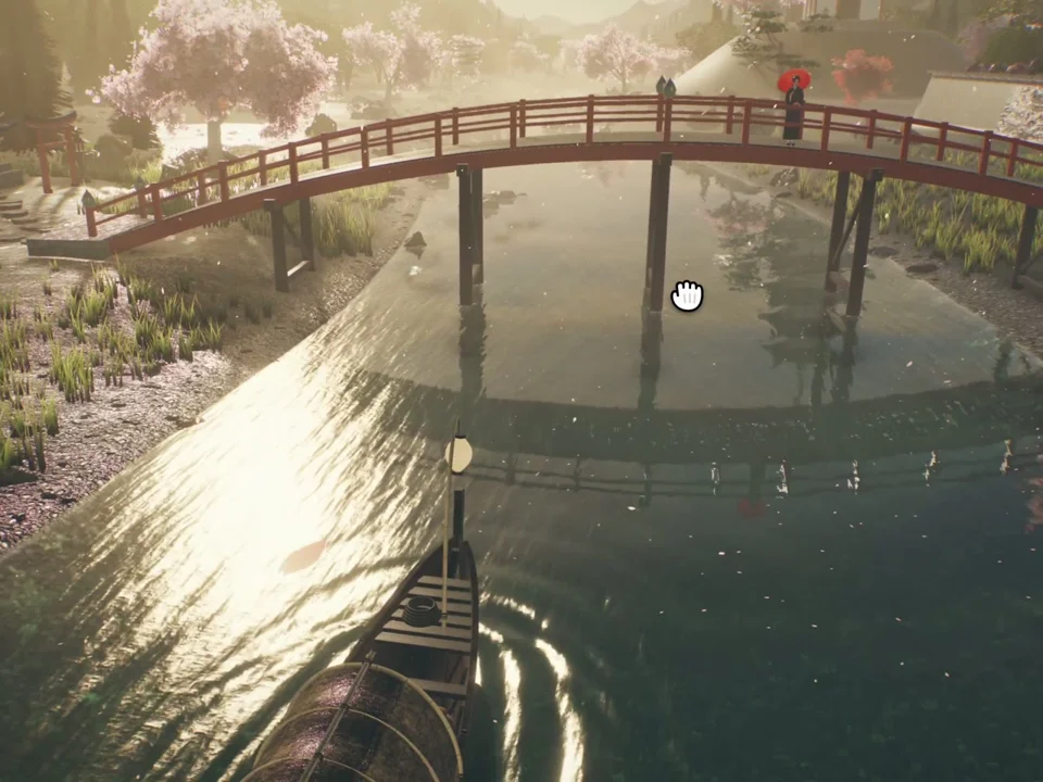 Boat ride under a red bridge through a Japanese garden
